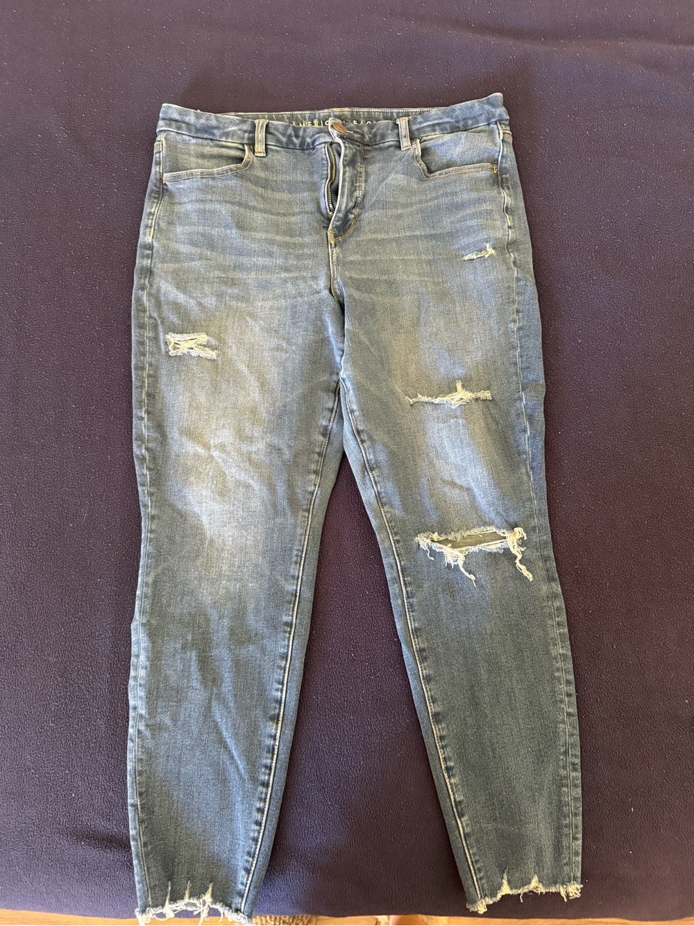 American Eagle Outfitters Distressed Skinny Jeans in Mid Blue Wash